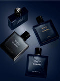 Bleu de Chanel perfume bottles on a dark reflective surface