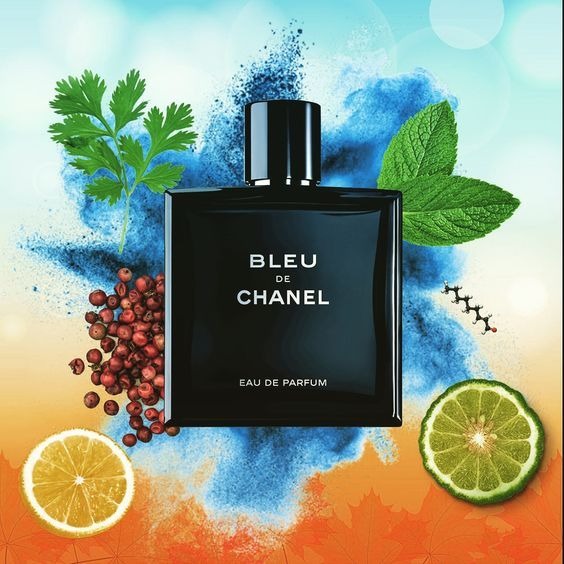 Bottle of Bleu de Chanel perfume with botanical elements on a colorful background