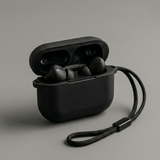 Black wireless earbuds in an open case on a gray background
