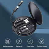 Black electronic accessory set with multiple interfaces, ejection pin, phone holder, and portable storage on a blue gradient background.