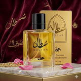 Perfume bottle and packaging with 'Sultan' branding on a maroon fabric background.