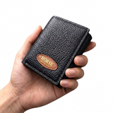 Hand holding a black leather wallet with 'Horse' branding on a white background