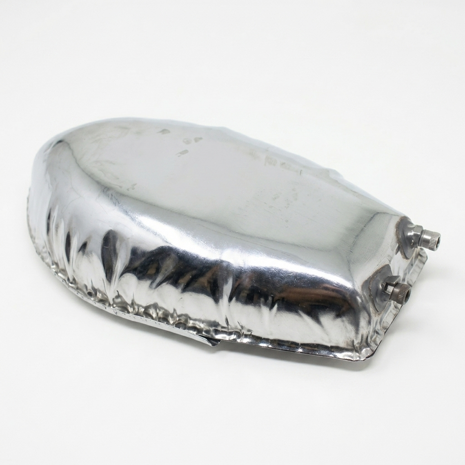 Chrome motorcycle fuel tank on a white background